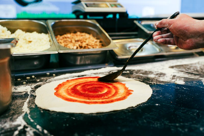 Pizza luce kitchen — fresh pizza luce being hand-crafted with quality ingredients