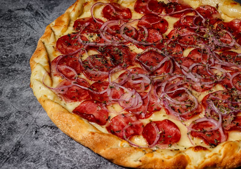 Spicy Calabrese luce pizza with salami and roasted peppers